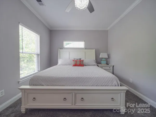 a bed room with a bed and a dresser