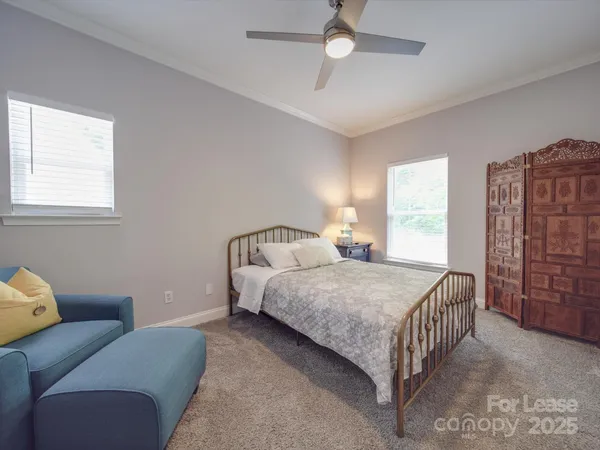 a bedroom with furniture and a window
