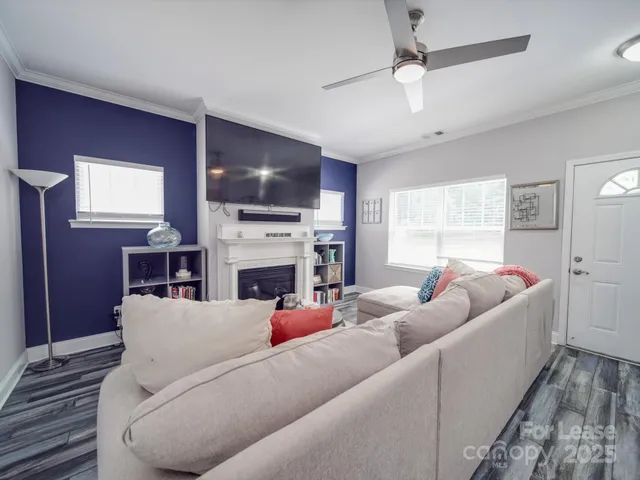 a view of a patio with table and chairs with wooden floor and fence