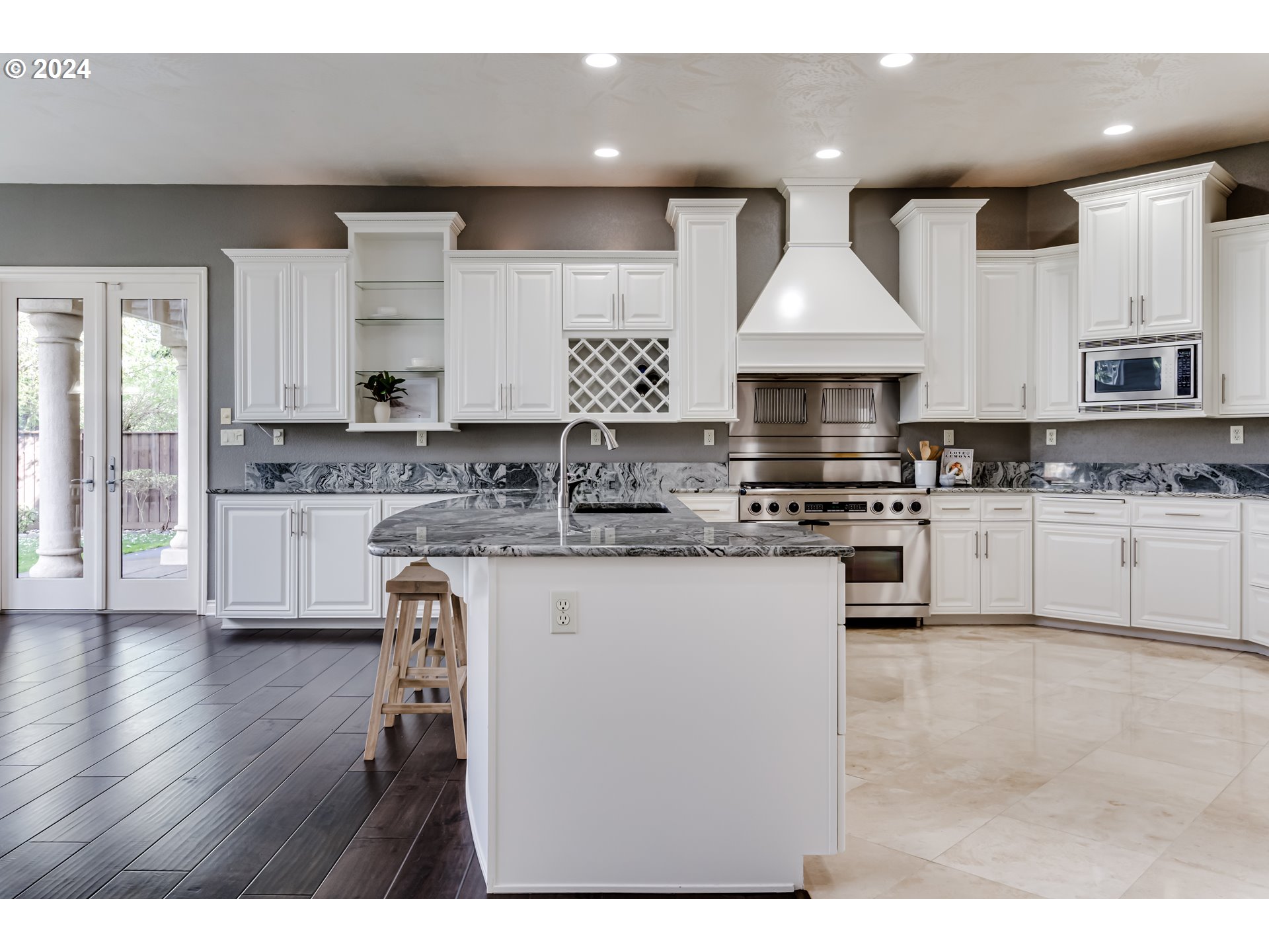 3740 Meadow View Drive Eugene, OR 97408 - Photo 14 of 46 a kitchen with stainless steel appliances granite countertop a stove sink and cabinets