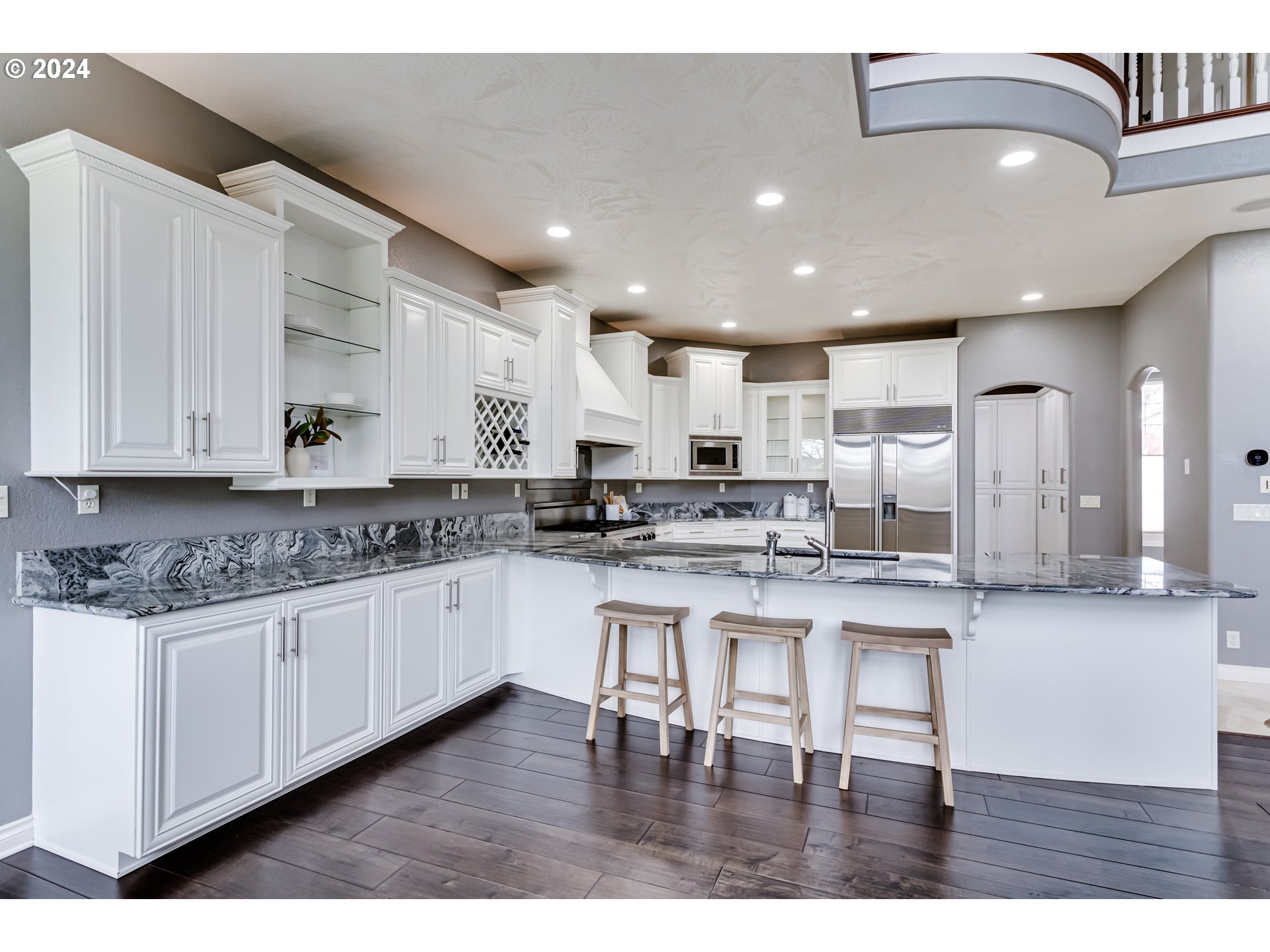 3740 Meadow View Drive Eugene, OR 97408 - Photo 15 of 46 a kitchen with stainless steel appliances granite countertop a white cabinets and wooden floor