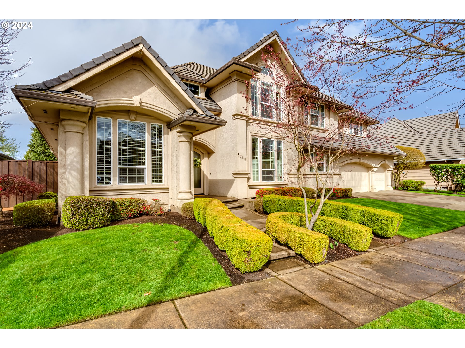 3740 Meadow View Drive Eugene, OR 97408 - Photo 2 of 46 a view of a white house with a yard table and chairs