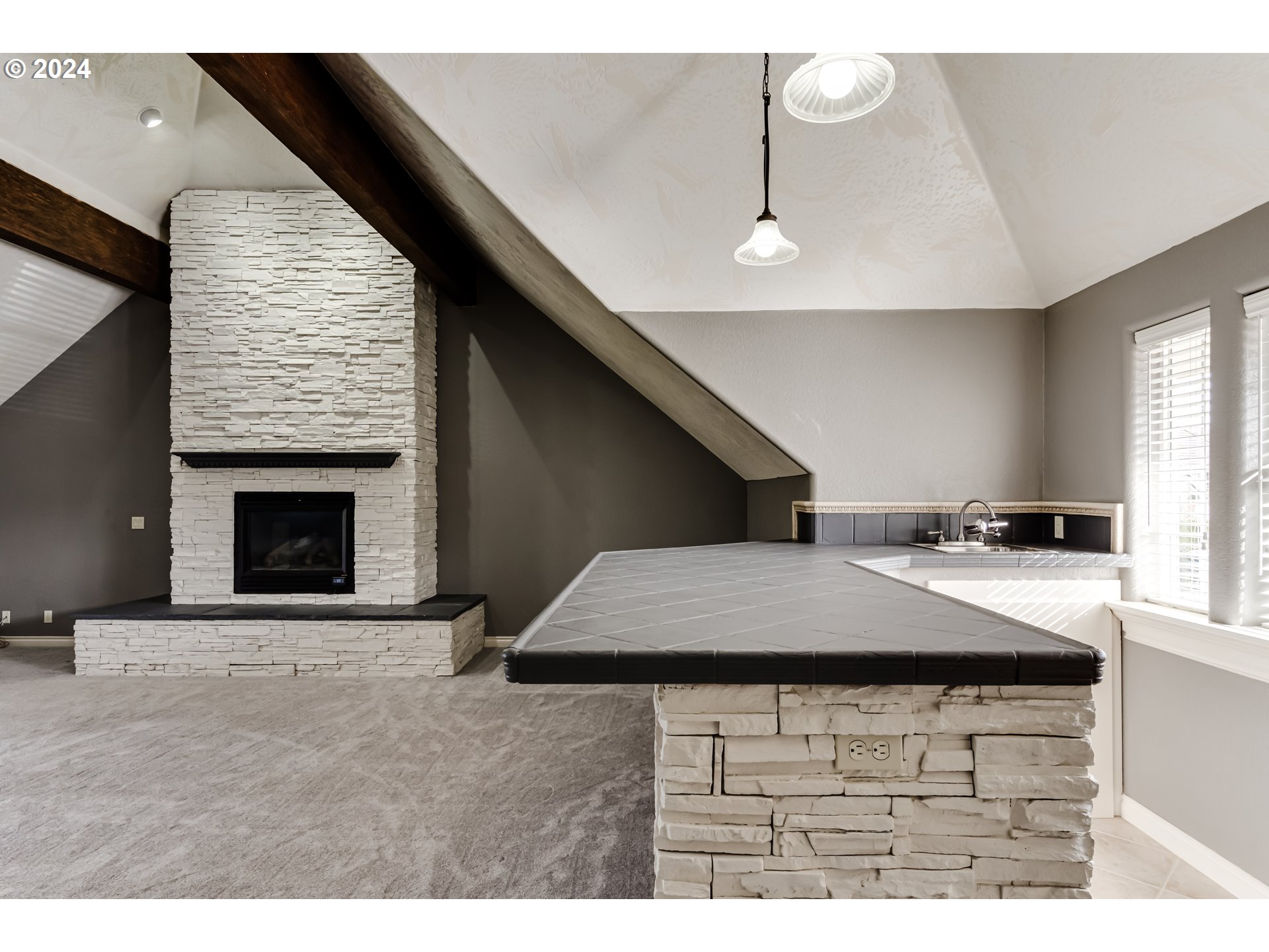 3740 Meadow View Drive Eugene, OR 97408 - Photo 25 of 46 a kitchen with a stove and a fireplace