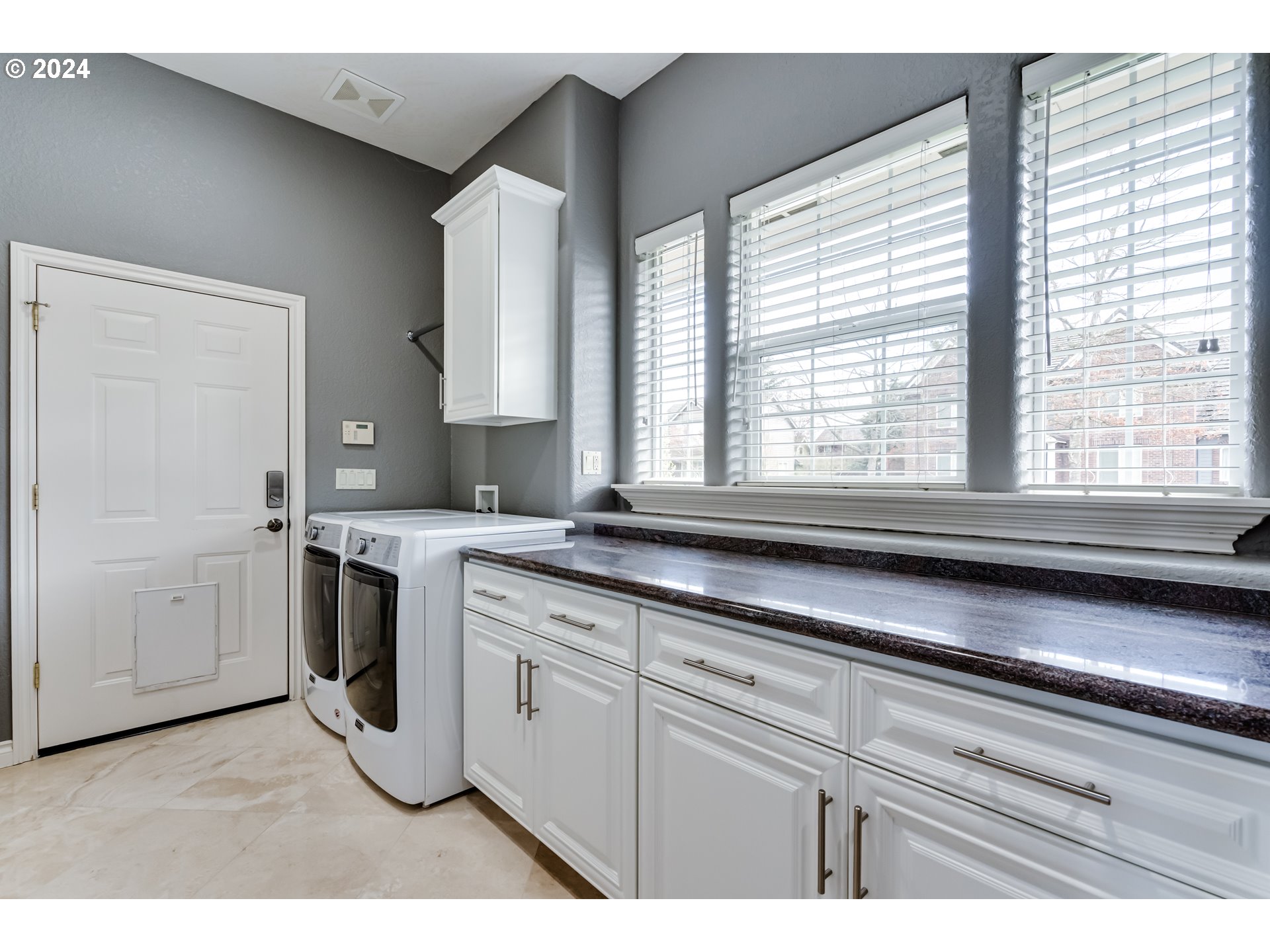 3740 Meadow View Drive Eugene, OR 97408 - Photo 39 of 46 a kitchen with a stove a sink and a window