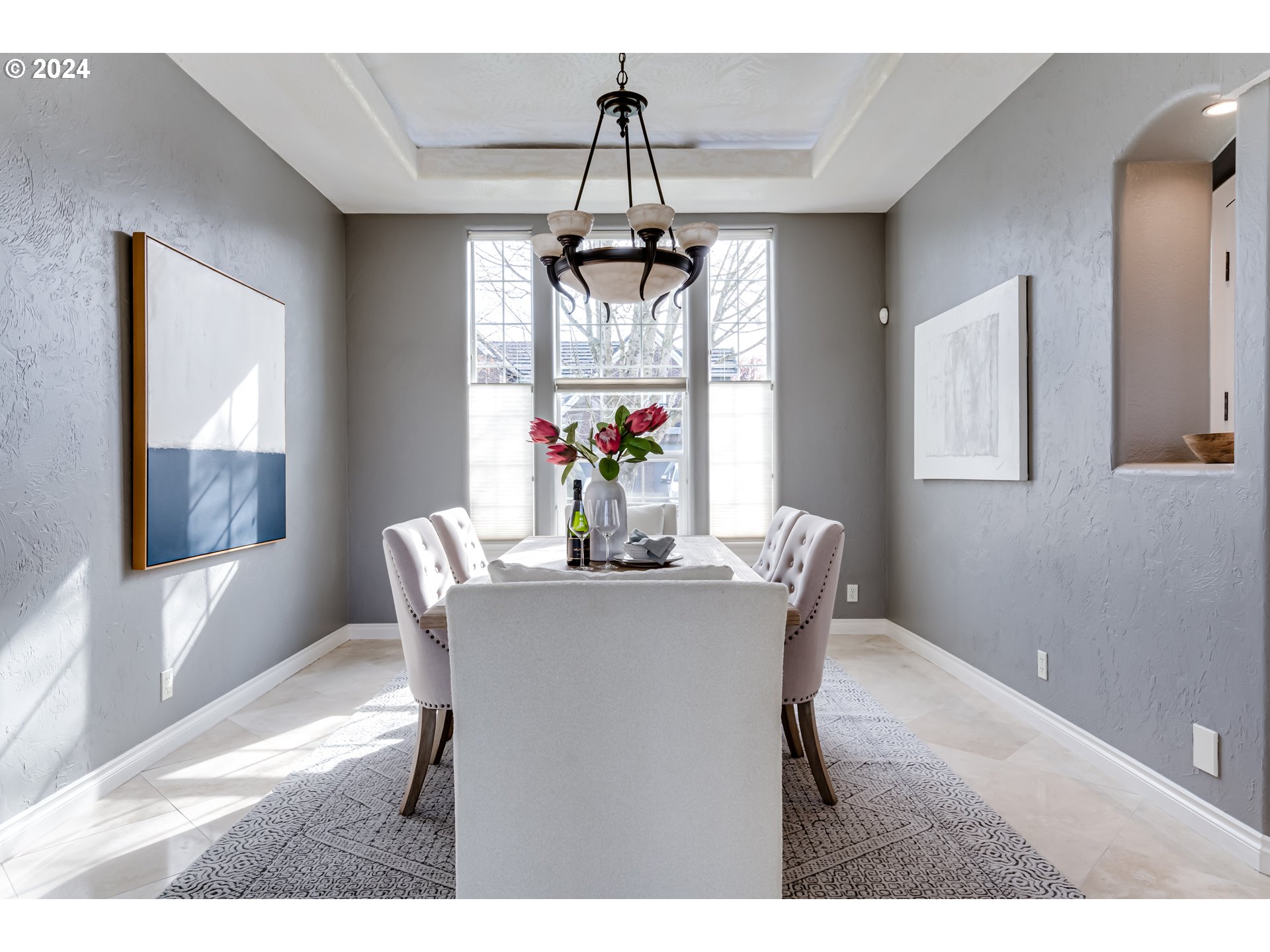 3740 Meadow View Drive Eugene, OR 97408 - Photo 6 of 46 a dining room with wooden floor a chandelier a wooden table and chairs