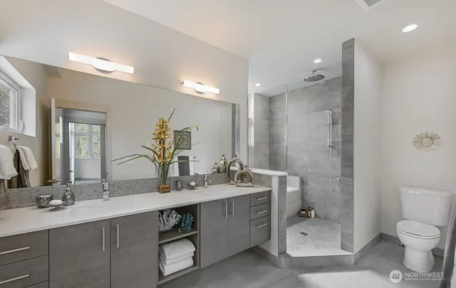 a bath tub sitting next to a shower