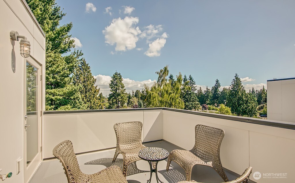 3516 Northeast 87th Street, Unit C Seattle, WA 98115 - Photo 17 of 18 a view of a chair and table in the balcony