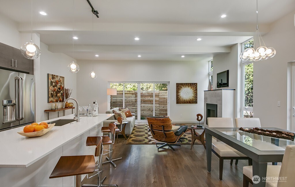 3516 Northeast 87th Street, Unit C Seattle, WA 98115 - Photo 10 of 18 a living room with furniture and a flat screen tv