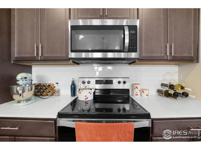 a kitchen with a stove and cabinets