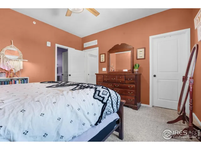 a view of a bedroom with a bed and a bathroom