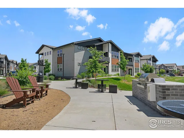 a view of a house with backyard sitting area and garden