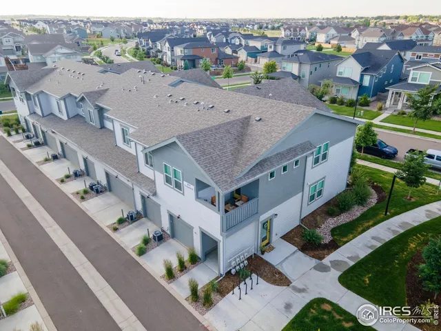 an aerial view of a house with a garden