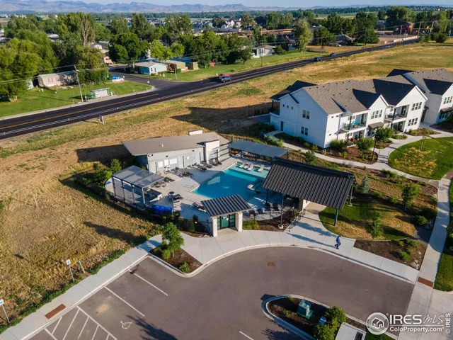 an aerial view of a house with yard swimming pool and outdoor seating