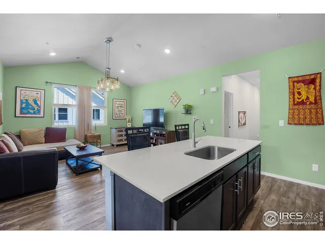 a kitchen with a sink and a refrigerator