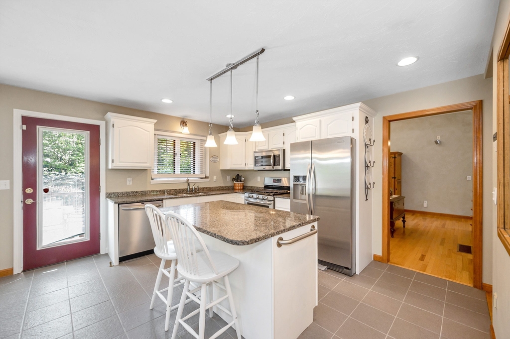 51 Tyler Road Townsend, MA 01469 - Photo 12 of 42 a kitchen with granite countertop a refrigerator and a sink