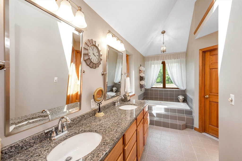 51 Tyler Road Townsend, MA 01469 - Photo 20 of 42 a bathroom with a granite countertop sink and a mirror