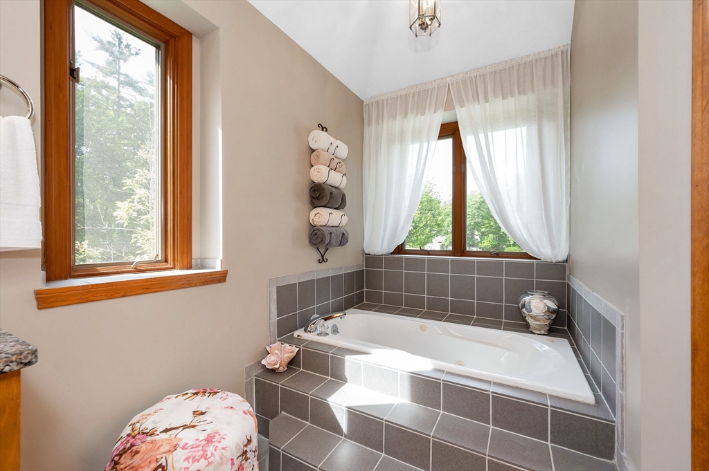 51 Tyler Road Townsend, MA 01469 - Photo 21 of 42 a bathroom with a bathtub and window