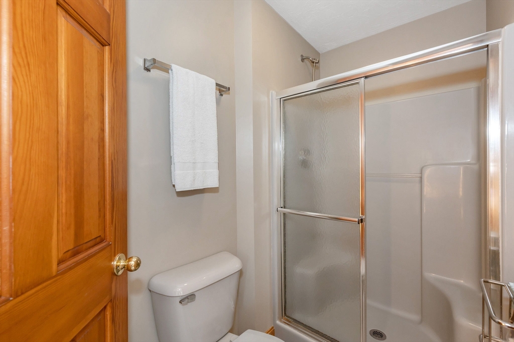 51 Tyler Road Townsend, MA 01469 - Photo 23 of 42 a bathroom with a glass shower door
