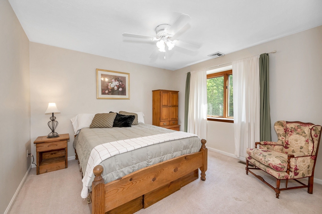 51 Tyler Road Townsend, MA 01469 - Photo 25 of 42 a bedroom with a bed and a couch