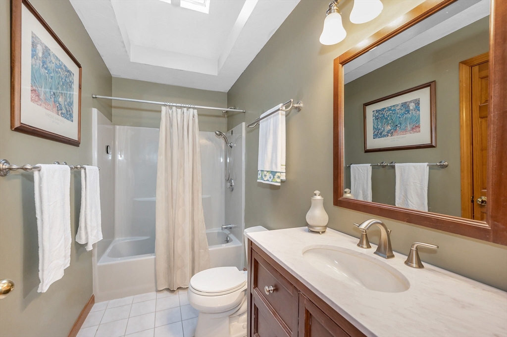 51 Tyler Road Townsend, MA 01469 - Photo 27 of 42 a bathroom with a granite countertop sink toilet and shower