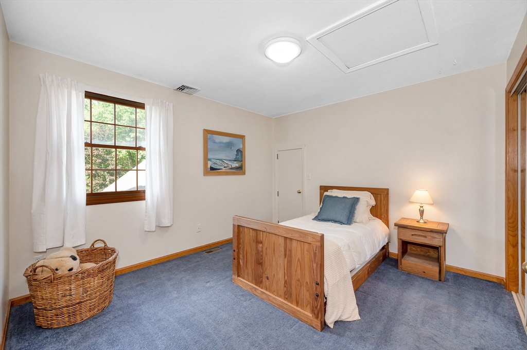 51 Tyler Road Townsend, MA 01469 - Photo 30 of 42 a bedroom with a bed and a window