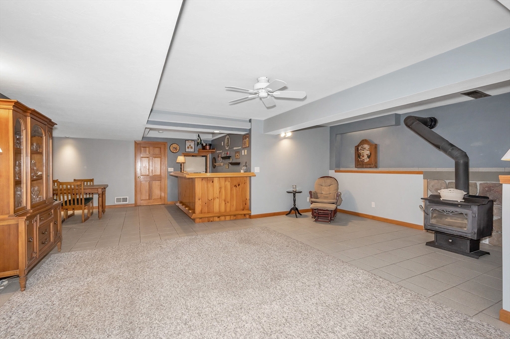 51 Tyler Road Townsend, MA 01469 - Photo 33 of 42 a living room with furniture and a flat screen tv