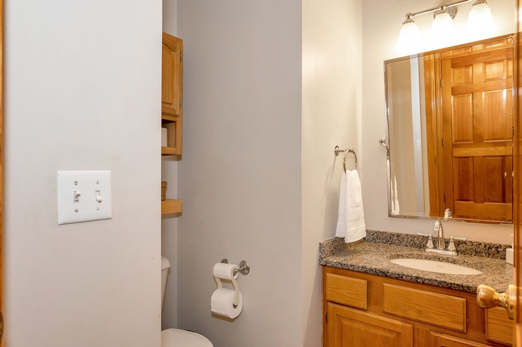 51 Tyler Road Townsend, MA 01469 - Photo 35 of 42 a bathroom with a granite countertop sink and a mirror