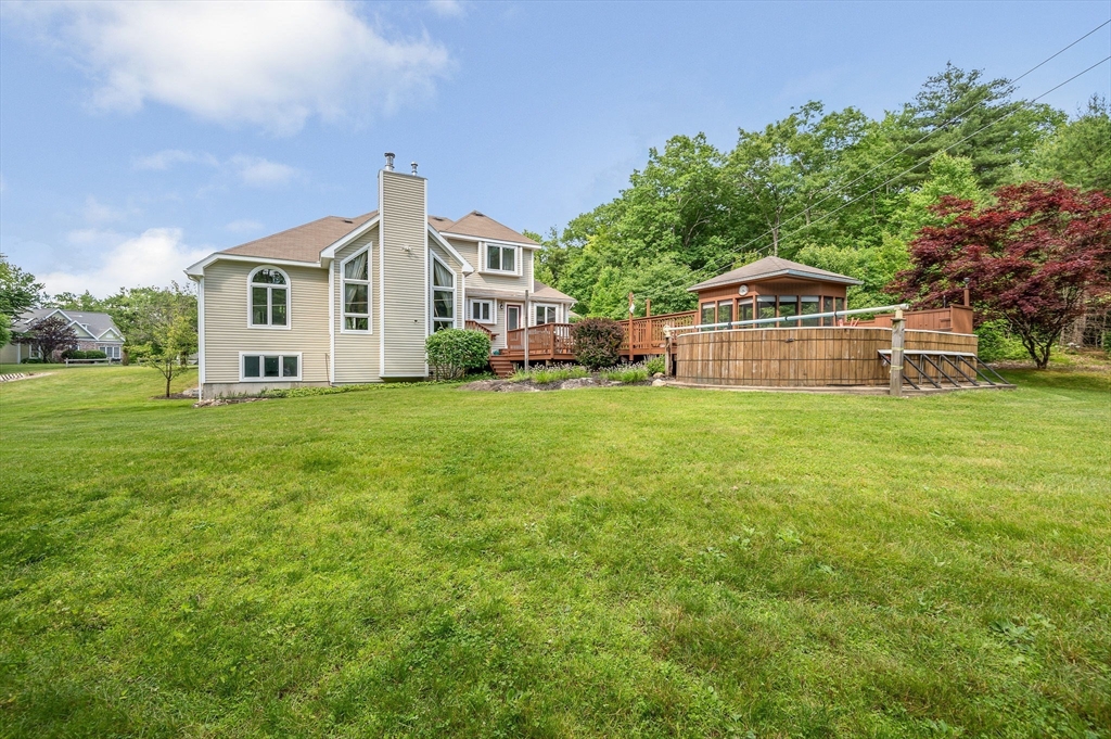 51 Tyler Road Townsend, MA 01469 - Photo 38 of 42 a front view of a house with a yard and garage