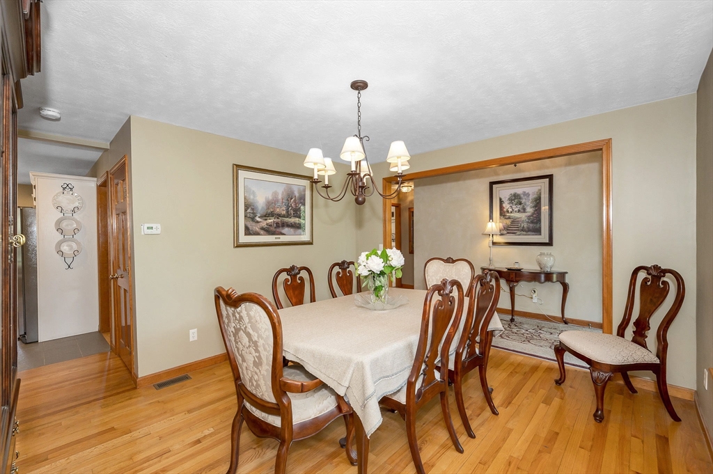 51 Tyler Road Townsend, MA 01469 - Photo 4 of 42 a dining room with furniture and chandelier