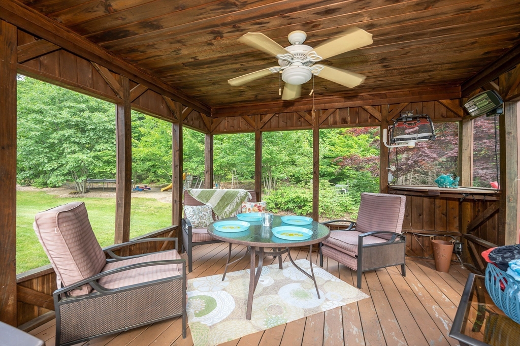 51 Tyler Road Townsend, MA 01469 - Photo 41 of 42 a living room with furniture and a floor to ceiling window