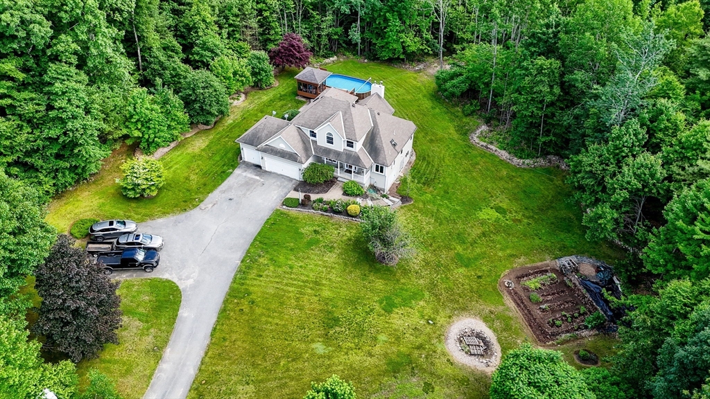 51 Tyler Road Townsend, MA 01469 - Photo 42 of 42 an aerial view of a house with a garden and swimming pool