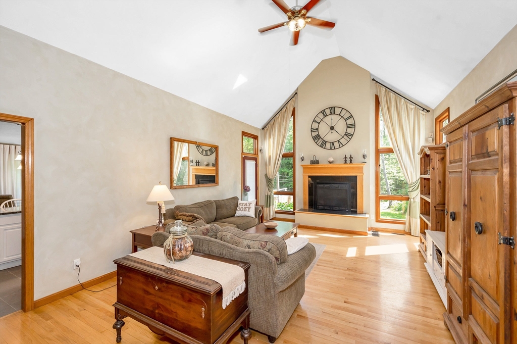 51 Tyler Road Townsend, MA 01469 - Photo 6 of 42 a living room with furniture a fireplace and a flat screen tv