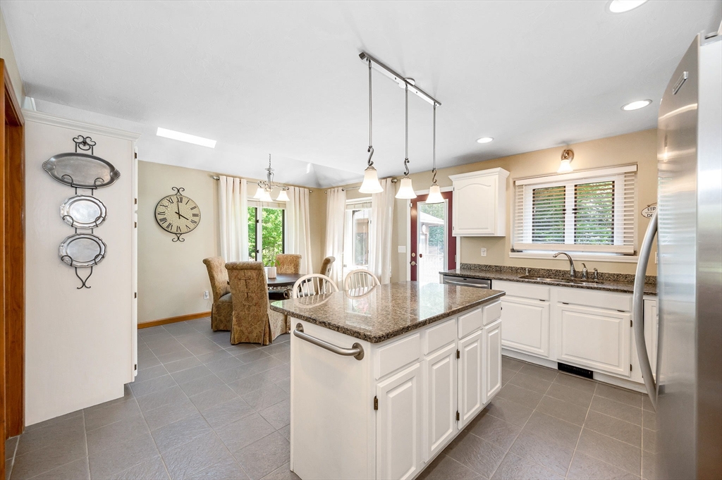 51 Tyler Road Townsend, MA 01469 - Photo 10 of 42 a kitchen with white cabinets and sink