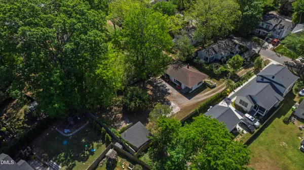 an aerial view of house with yard