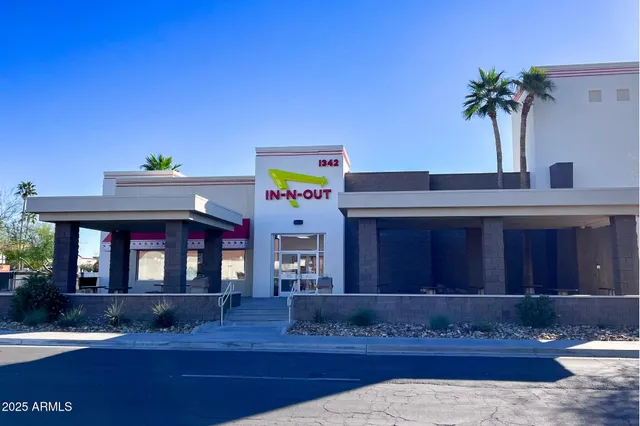 a view of the cars park in front of building