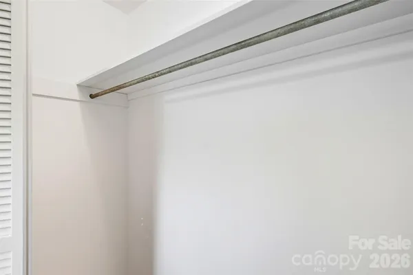 a bathroom with a sink toilet and mirror