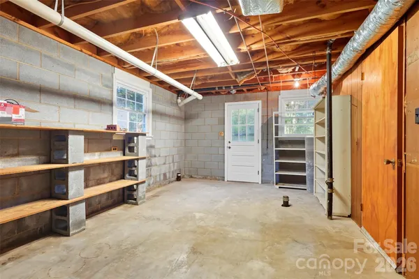a view of a room with wooden floor and roof