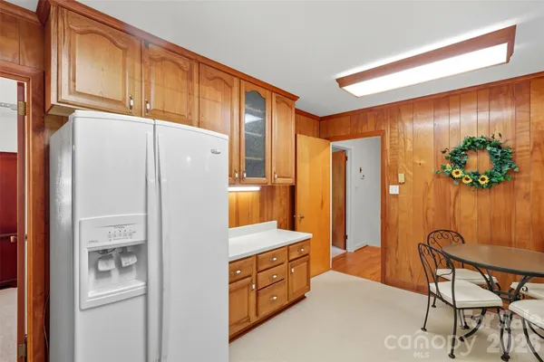 a kitchen with stainless steel appliances a refrigerator and a stove