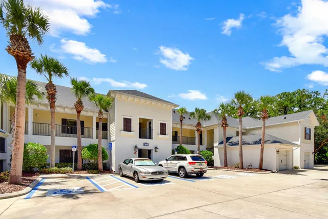 a view of a street with cars