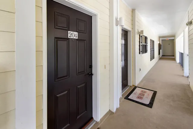 a view of a hallway with windows