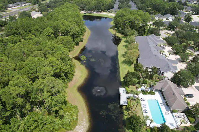 a view of a lake with a yard
