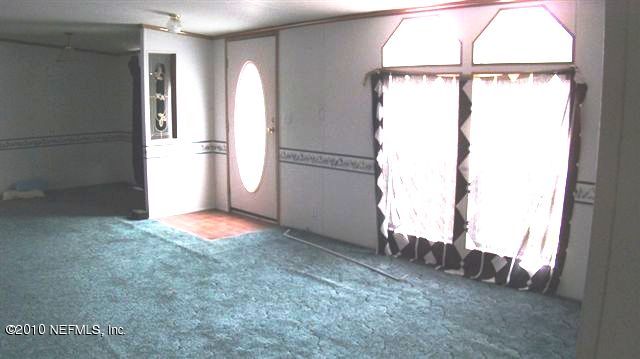12565 Shark Road Jacksonville, FL 32226 - Photo 11 of 14 a view of an empty room with a window