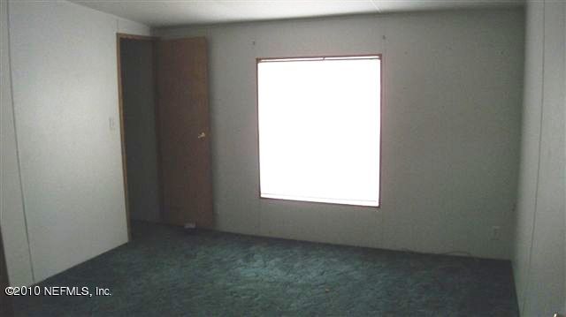 12565 Shark Road Jacksonville, FL 32226 - Photo 5 of 14 a view of an empty room and window