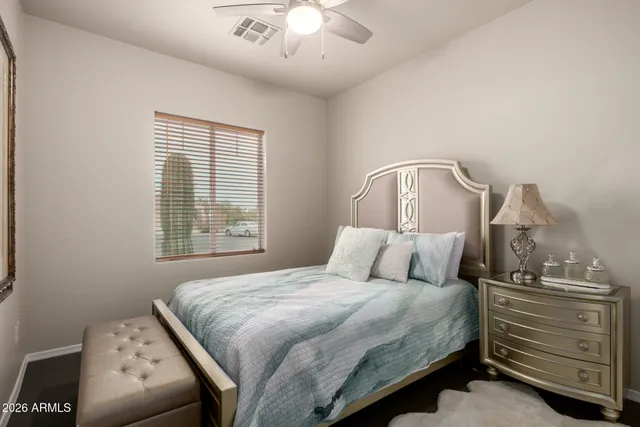 a bedroom with a bed and a dresser