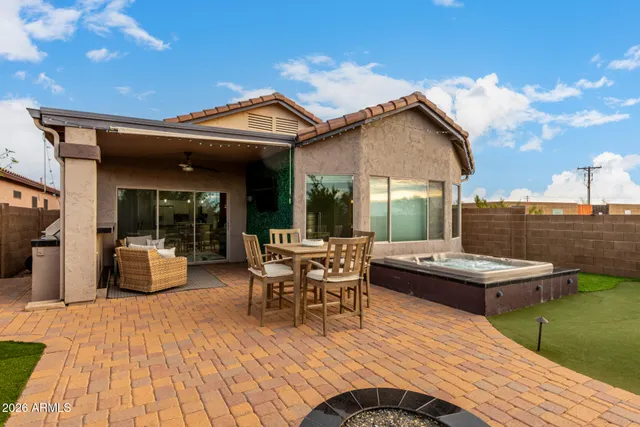 a patio view with a table and chairs