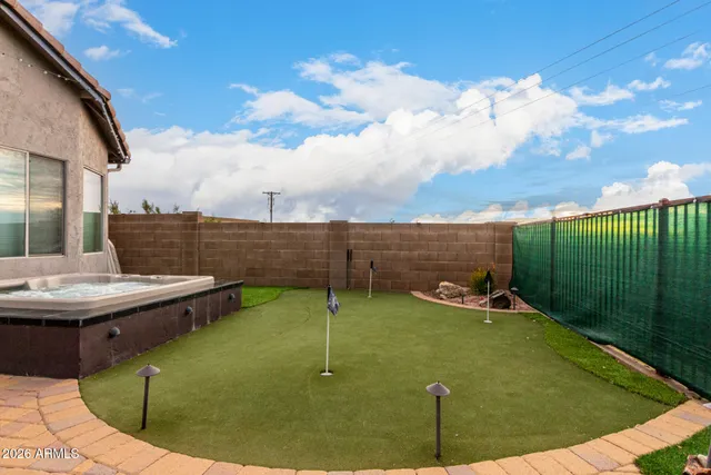 a view of a swimming pool with a yard