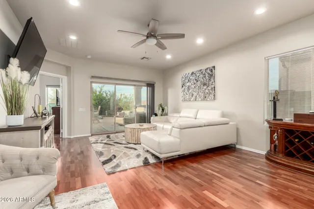 a living room with furniture and a large window