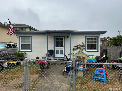 a view of play house with a yard
