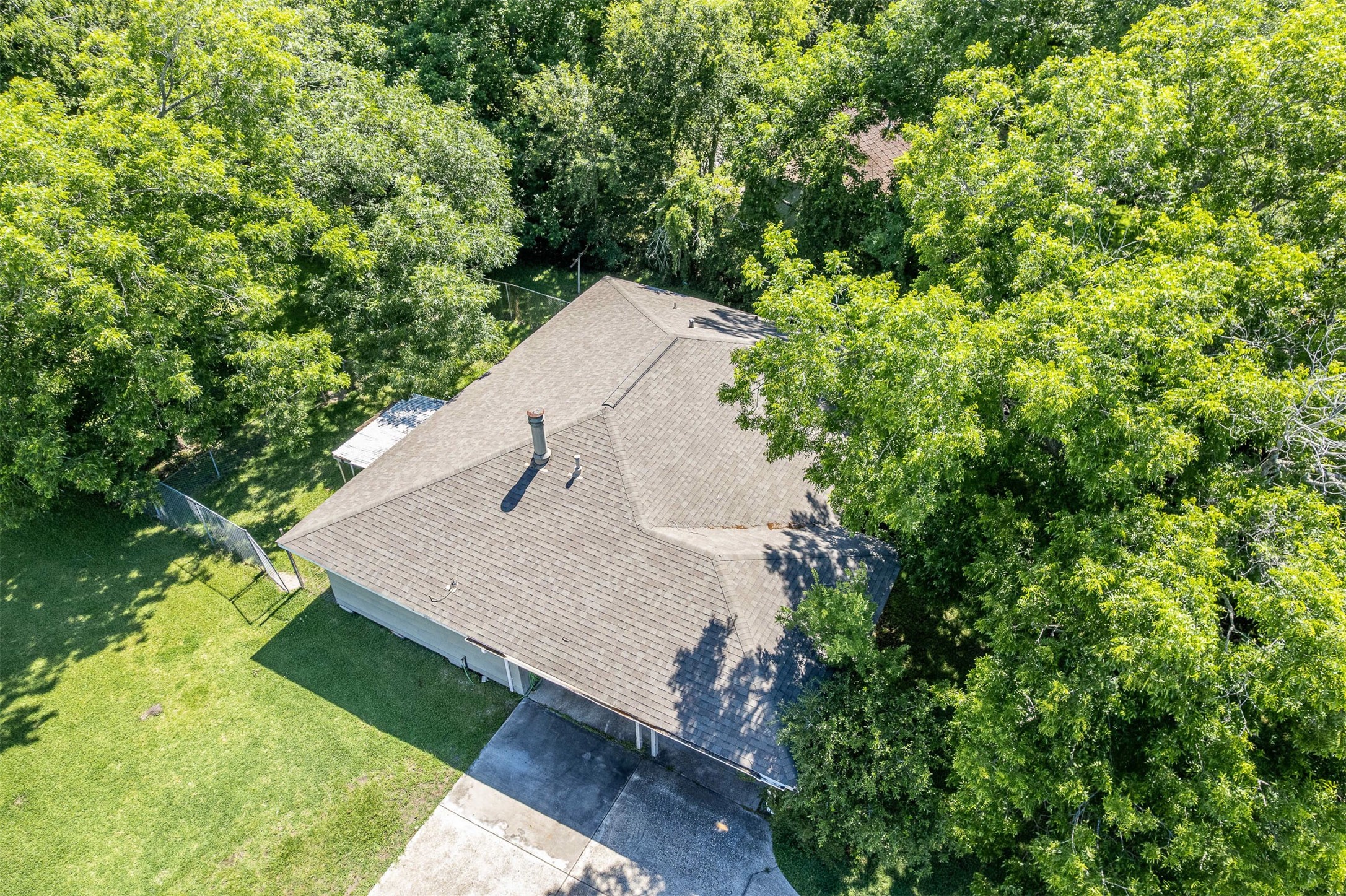 502 Massey Tompkins Road Baytown, TX 77521 - Photo 26 of 32 a view of a yard in a forest