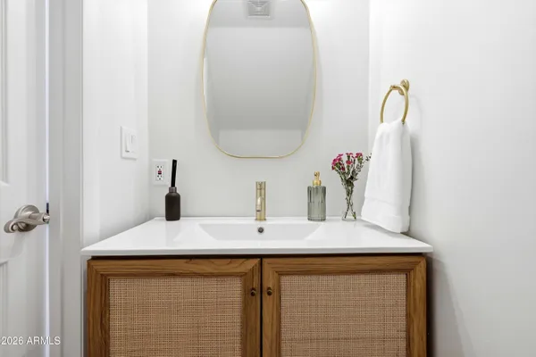 a bathroom with a sink and a mirror